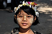 Myanmar - Inwa, Innwa girl wearing traditional makeup (Thanaka) 